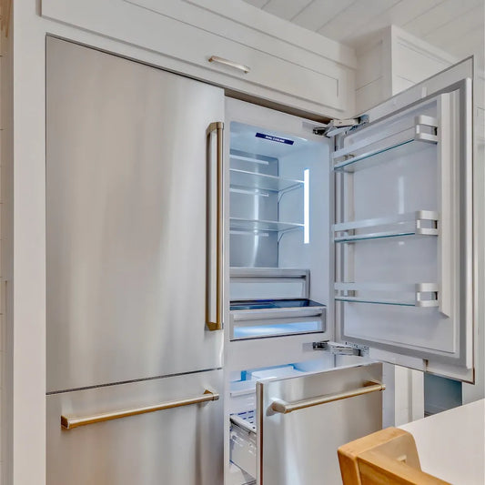 ZLINE 60 in. 32.2 cu. ft. French Door Built-In Bottom Freezer Refrigerator with Water Dispensers and Ice Makers in Stainless Steel (RBIV-304-60) with open door in a kitchen setting