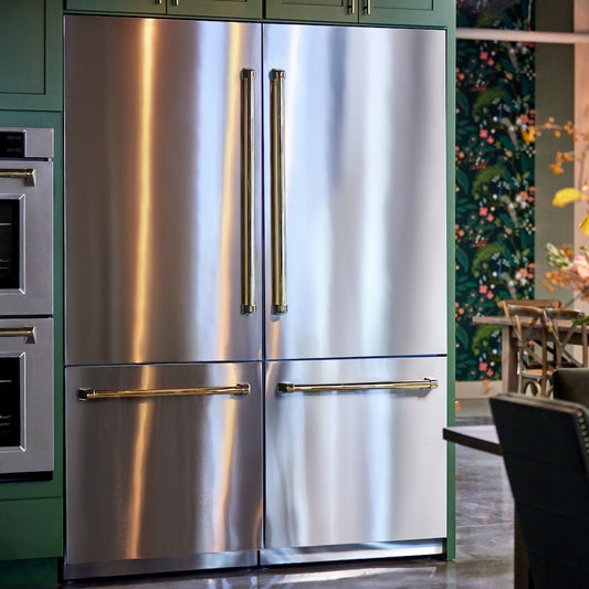 ZLINE Autograph Edition 60 in. 32.2 cu. ft. French Door Built-In Bottom Freezer Refrigerator with Water Dispenser and Ice Maker in Stainless Steel with Polished Gold Accents (RBIVZ-304-60-G) in a kitchen setting with green cabinets and a floral wall.