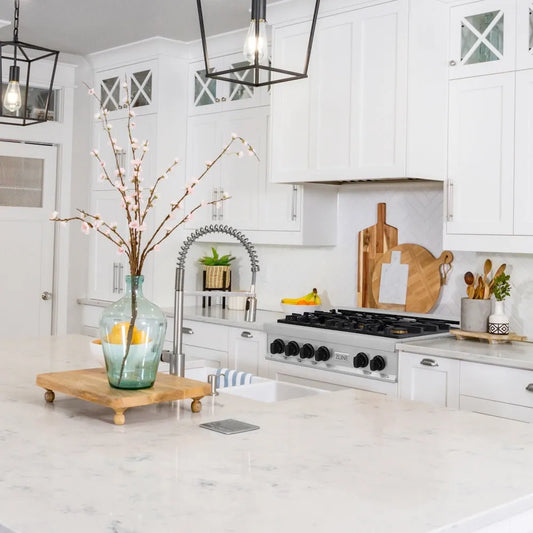 ZLINE Autograph Edition 36 in. Legacy Gas Rangetop with 6 Burners and Porcelain Cooktop in Stainless Steel with Matte Black Accents (RTZ-36-MB) in a farmhouse kitchen with white cabinets, marble countertops, and decorative elements.