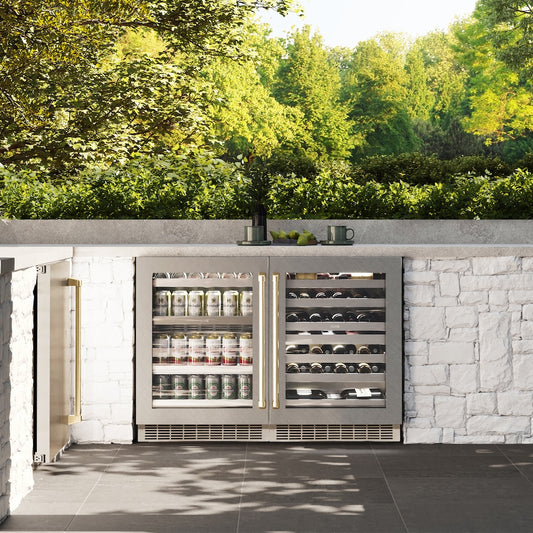 ZLINE Autograph Edition 24 in. Touchstone 151 Can Beverage Fridge With Satin Stainless Steel Glass Door And Champagne Bronze Handle (RBSOZ-SN-24-CB) front, in a luxury outdoor kitchen.