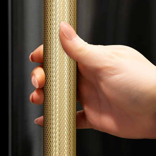 ZLINE Autograph Edition 60 in. 32.2 cu. ft. French Door Built-In Bottom Freezer Refrigerator with Water Dispenser and Ice Maker in Black Stainless Steel with Graphite Gray Interior and Champagne Bronze Helix Handles (GRBIVZ-BS60KCB) hand holding Helix handle showing knurled diamond texture.