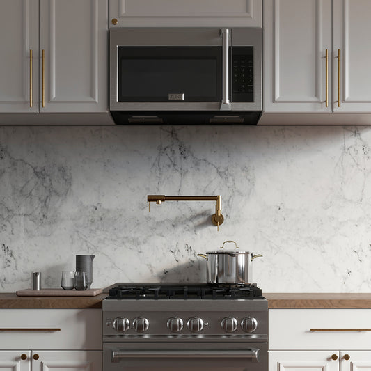 ZLINE 30 in. Stainless Steel Over the Range Convection Microwave Oven with Traditional Handle (MWO-OTR-H-30) in a white marble kitchen with wood details.