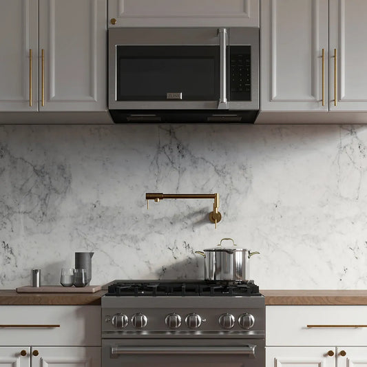 ZLINE 30 in. Stainless Steel Over the Range Convection Microwave Oven with Traditional Handle (MWO-OTR-H-30) in a white marble kitchen with wood details.