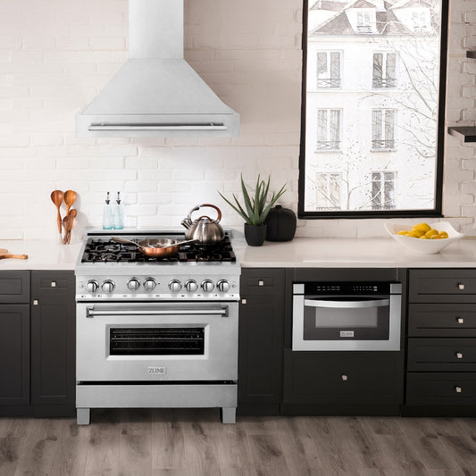 ZLINE 36 in. Satin Stainless Steel Wall Mount Range Hood with Stainless Steel Handle (8654SNX-36) in a luxury kitchen.