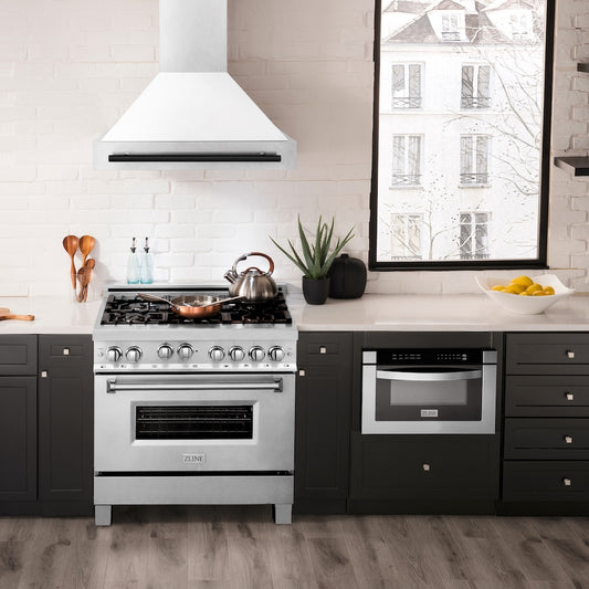 ZLINE Autograph Edition 36 in. Satin Stainless Steel Wall Mount Range Hood with White Matte Shell and Matte Black Handle (8654SNZ-WM36-MB) in a luxury kitchen.