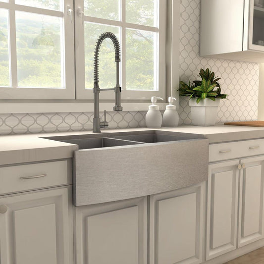 ZLINE Apollo Pull Down Spring Single Handle Kitchen Faucet in Gun Metal (APL-KF-GM) in a farmhouse kitchen, side.