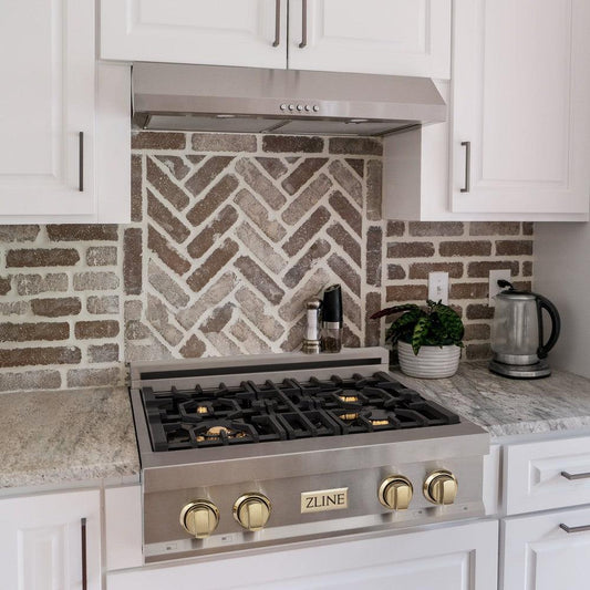 ZLINE Autograph Edition 30 in. Legacy Gas Rangetop with 4 Burners and Porcelain Cooktop in Stainless Steel with Polished Gold Accents (RTZ-30-G) lifestyle, in a luxury kitchen.