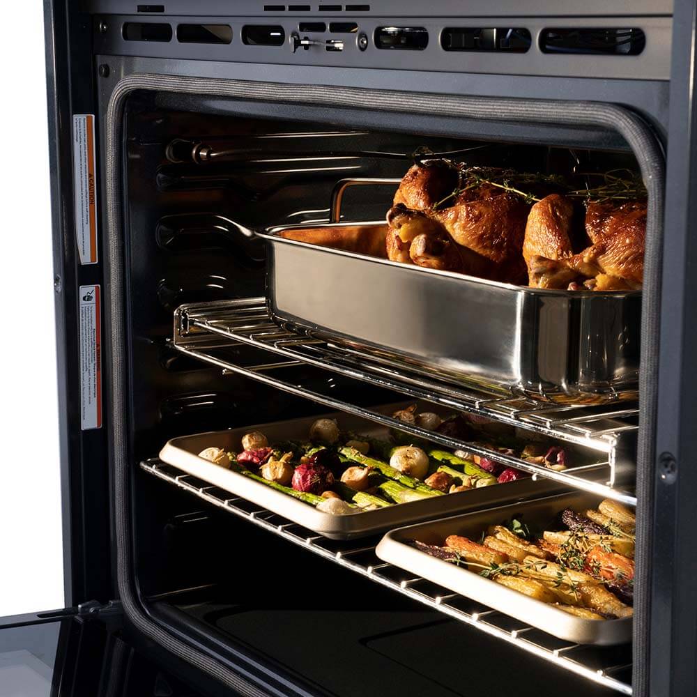 Close-up food cooking on top and bottom racks inside ZLINE Autograph Edition 30 in. Electric Double Wall Oven with Self Clean and True Convection in Stainless Steel and Polished Gold Accents (AWDZ-30-G)