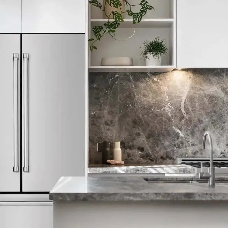 Modern kitchen featuring a stainless steel ZLINE refrigerator, gray marble backsplash, and white cabinetry.