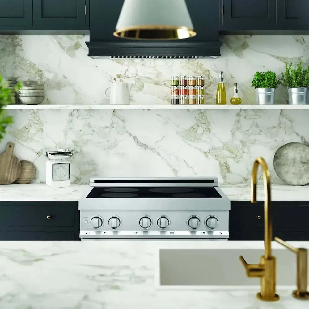 Stainless steel ZLINE 30-inch induction range set in a modern kitchen with marble backsplash and dark cabinetry.