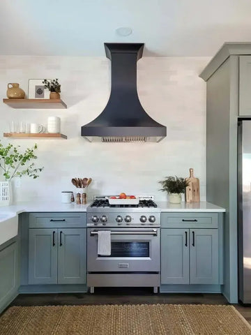 Modern kitchen featuring a ZLINE stainless steel gas range and a matte black wall-mount range hood.