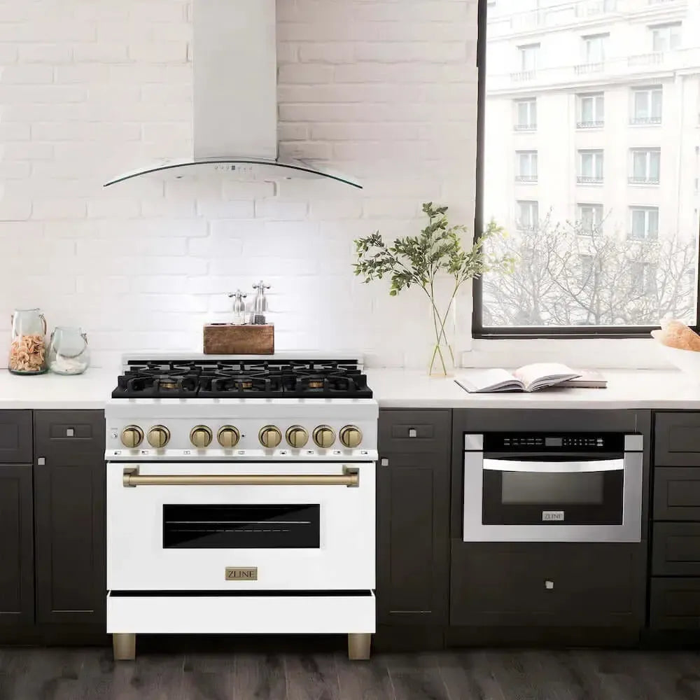 ZLINE Autograph Edition white gas range with gold accents and matching stainless steel range hood in a modern kitchen.