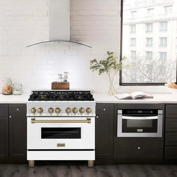 ZLINE Autograph Edition white gas range with gold accents and matching stainless steel range hood in a modern kitchen.