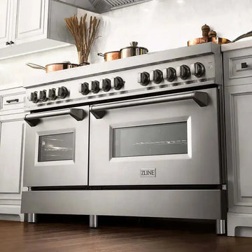 Stainless steel ZLINE 60-inch dual fuel range with double ovens and professional knobs in a modern kitchen.