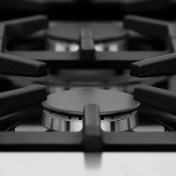 Close-up of a durable black cast iron gas stove burner with a sleek, modern metallic finish.