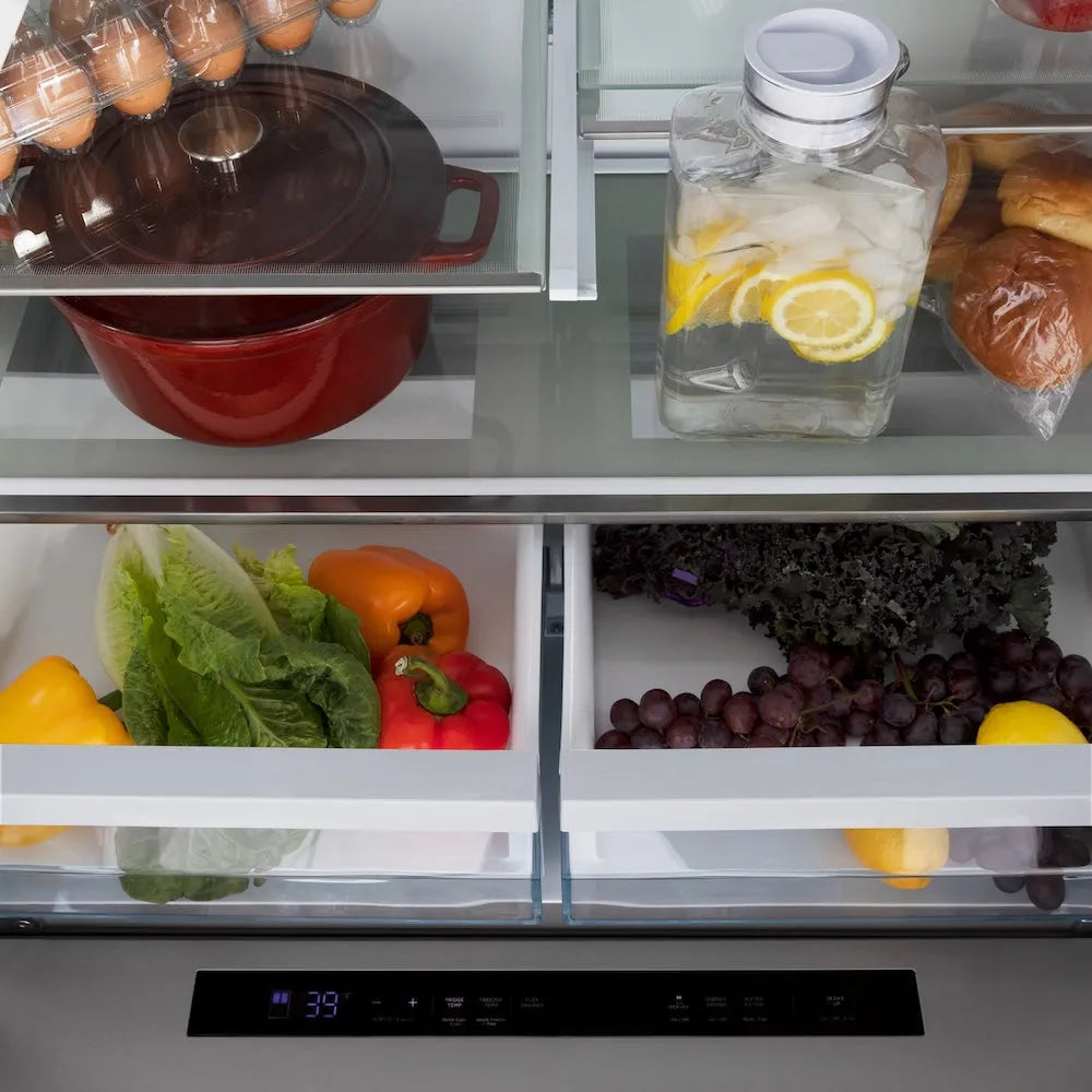 Open ZLINE Autograph Edition 36 in. 21.6 cu. ft. Counter-Depth French Door Refrigerator with Water and Ice Dispenser in Fingerprint-Resistant Stainless Steel with Champagne Bronze Traditional Handles (RFMZ-W-36-CB) with food items including fruits, vegetables, and a water bottle.