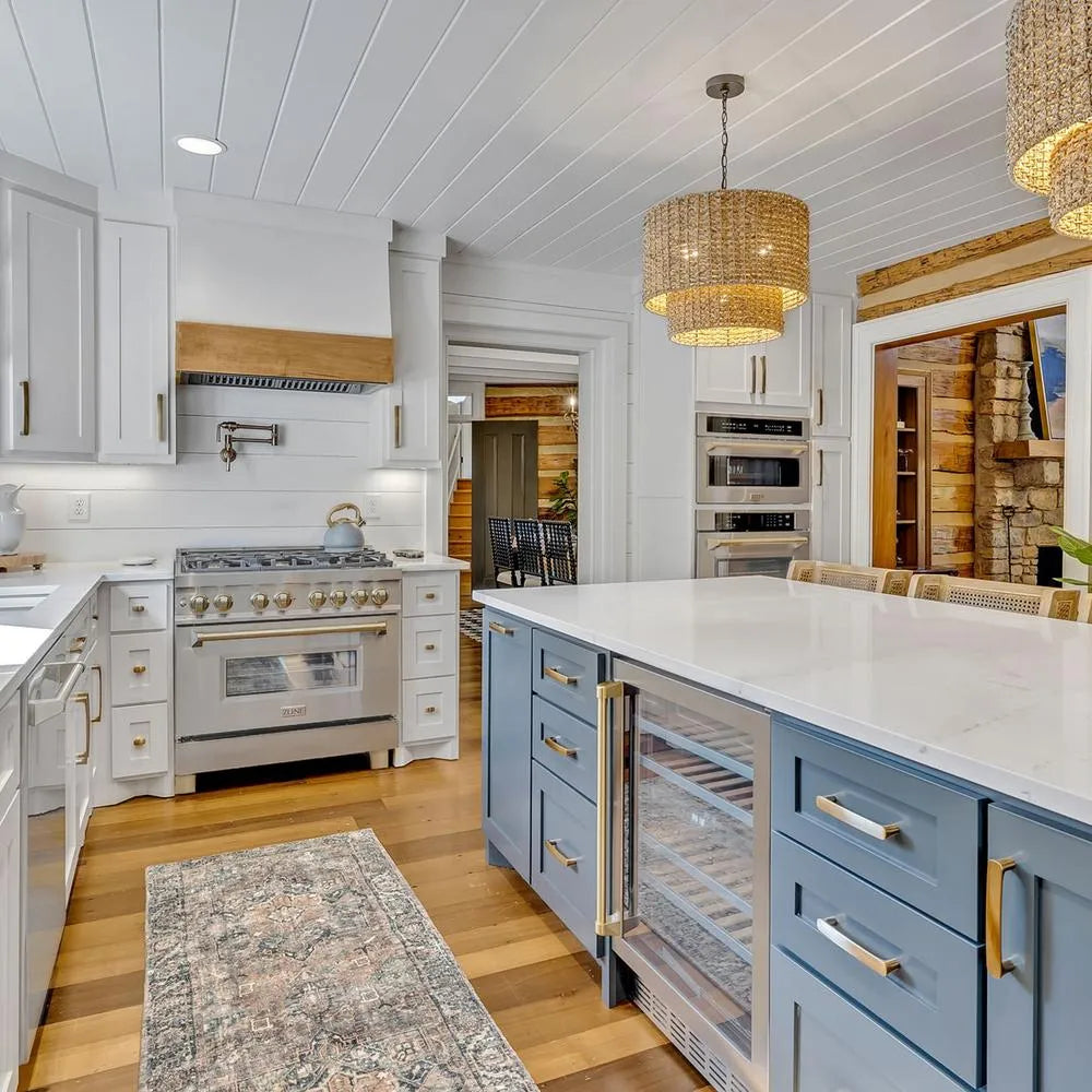 Rustic kitchen with white countertops, blue island, and ZLINE Autograph Edition 36 in. 4.6 cu. ft. Legacy Dual Fuel Range with 6 Burner Gas Cooktop and Electric Convection Oven in Stainless Steel and Champagne Bronze Accents (RAZ-36-CB)