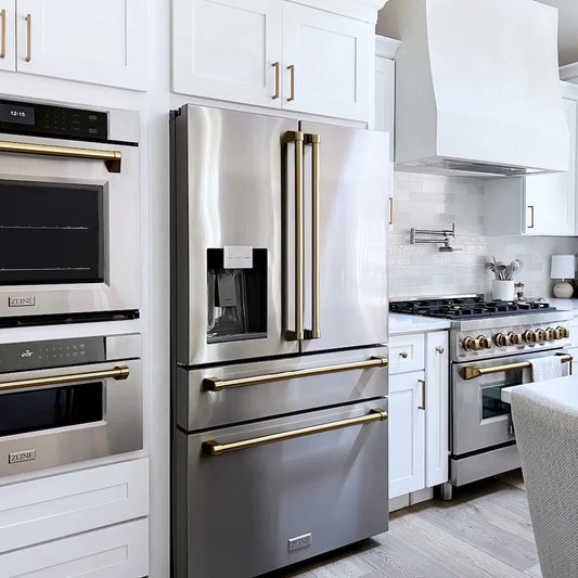 Farmhouse kitchen with matching stainless steel appliances, including a ZLINE Autograph Edition 36 in. 21.6 cu. ft. Counter-Depth French Door Refrigerator with Water and Ice Dispenser in Fingerprint-Resistant Stainless Steel with Champagne Bronze Traditional Handles (RFMZ-W-36-CB), wall oven, and range.