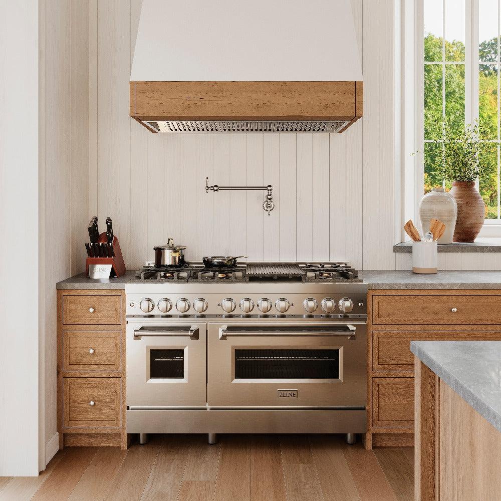 ZLINE Rembrandt Pot Filler in Chrome (REM-FPF-CH) above a large range in a farmhouse-style kitchen, front.