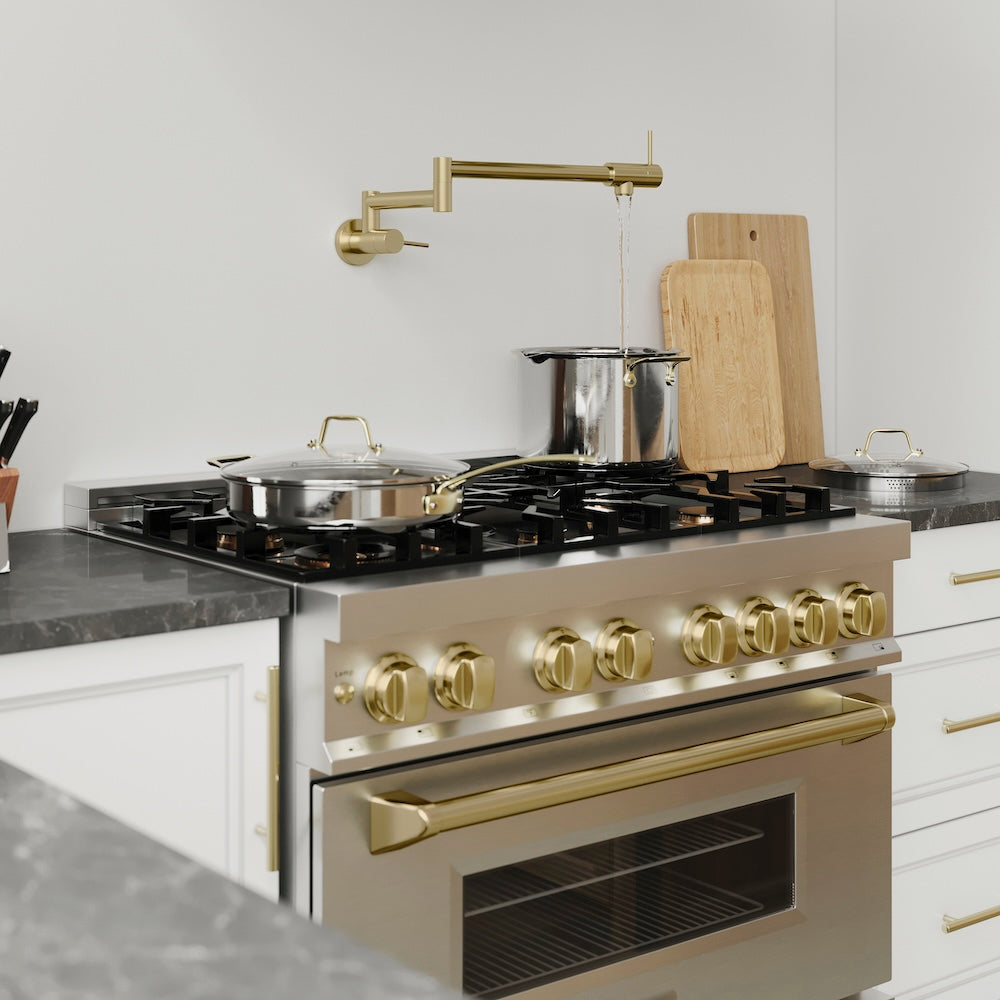 ZLINE Gemini Pot Filler in Champagne Bronze (GEM-FPF-CB) above a stainless steel range with bronze accents in a modern kitchen setting, on.
