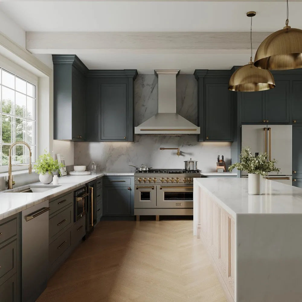 ZLINE Autograph Edition 48 in. Stainless Steel Range Hood with Stainless Steel Shell and Champagne Bronze Handle (8654STZ-48-CB) in a luxury kitchen with marble countertops and blue kitchen cabinets.