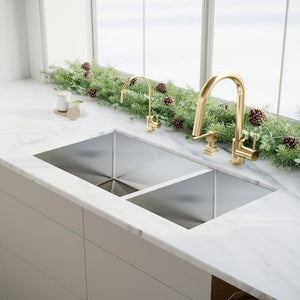 ZLINE Single Handle Drink Faucet in Polished Gold (FBV-PG) in a luxury kitchen with a matching faucet and soap dispenser.