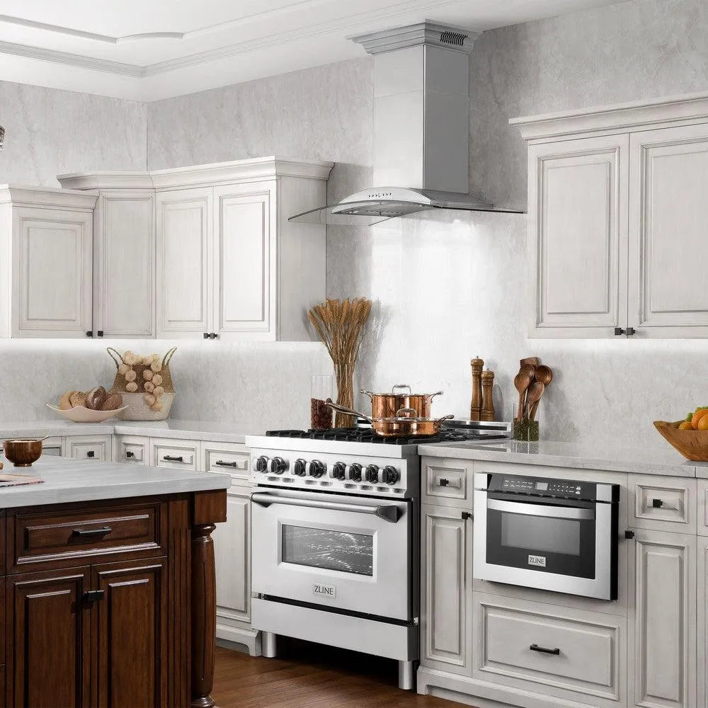 Farmhouse kitchen with white cabinets, ZLINE 30 in. CrownSound™ Ducted Vent Wall Mount Range Hood in Stainless Steel and Glass with Built-in Bluetooth Speakers (KNCRN-BT-30), and wooden accents.