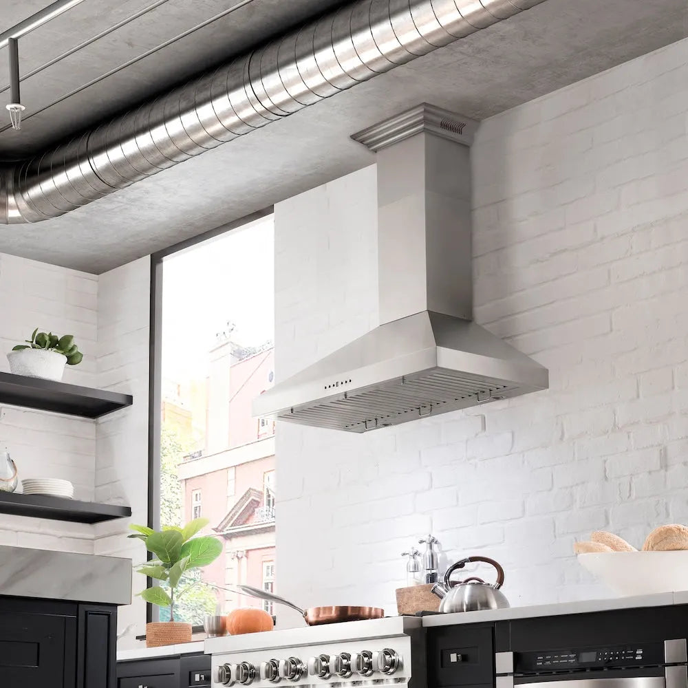 Modern kitchen with ZLINE 48 in. CrownSound™ Ducted Vent Wall Mount Range Hood in Stainless Steel with Built-in Bluetooth Speakers (KL3CRN-BT-48) and a white tiled wall.