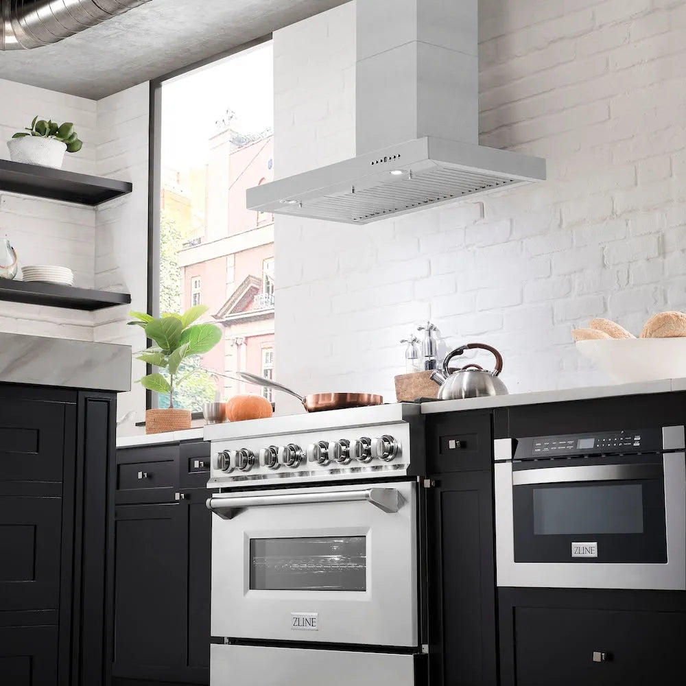 Modern kitchen with ZLINE 36 in. Convertible Vent Wall Mount Range Hood in Stainless Steel (KE-36), stainless steel appliances and black cabinets