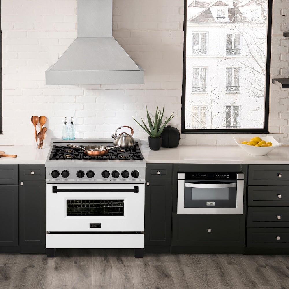 ZLINE Autograph Edition 36 in. 4.6 cu. ft. Legacy Dual Fuel Range with 6 Burner Gas Cooktop and Electric Convection Oven in Satin Stainless Steel with White Matte Door and Matte Black Accents (RASZ-WM-36-MB) in a kitchen with white countertops, and a window view.