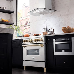 Modern kitchen with ZLINE Autograph Edition 36 in. 4.6 cu. ft. Legacy Dual Fuel Range with 6 Burner Gas Cooktop and Electric Convection Oven in Stainless Steel and Polished Gold Accents (RAZ-36-G), black cabinets, and white brick wall.