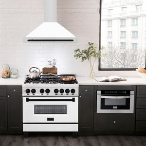 ZLINE Autograph Edition Convertible Stainless Steel Range Hood with White Matte Shell and Matte Black Accents (KB4STZ-WM-MB) in a luxury compact kitchen with matching range and microwave, front.