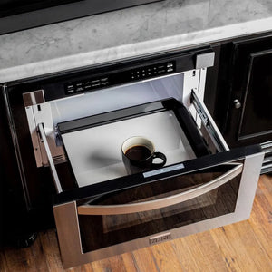 ZLINE 24 in. 1.2 cu. ft. Stainless Steel Built-in Microwave Drawer (MWD-1) open, with a cup of coffee inside.
