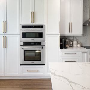 Modern kitchen with ZLINE 30 in. Professional True Convection Single Wall Oven with Air Fry and Self Clean in Stainless Steel (WAS-30), white cabinets, marble countertop, and stainless steel appliances.