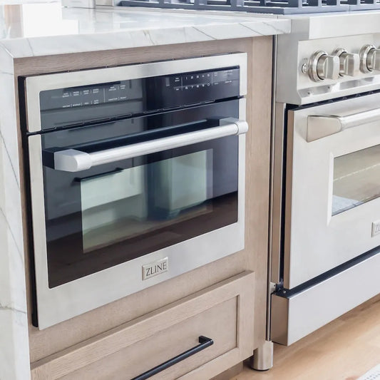 ZLINE 24 in. 1.6 cu. ft. Built-in Convection Microwave Oven in Stainless Steel with Speed and Sensor Cooking (MWO-24) in a kitchen setting with wood cabinets