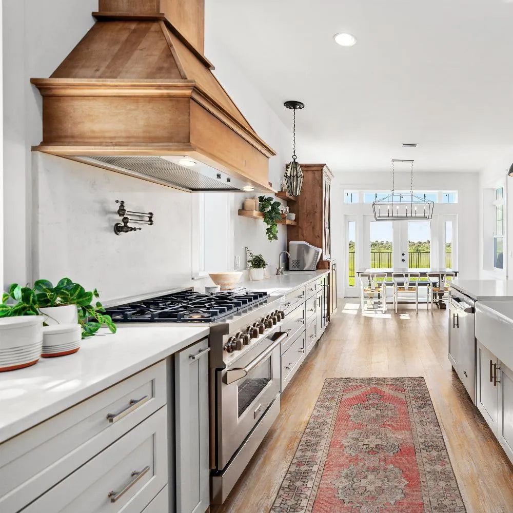 ZLINE 36 in. 4.6 cu. ft. Legacy Dual Fuel Range with 6 Burner Gas Cooktop and Electric Convection Oven in Stainless Steel (RA36) in a luxury farmhouse-style kitchen.