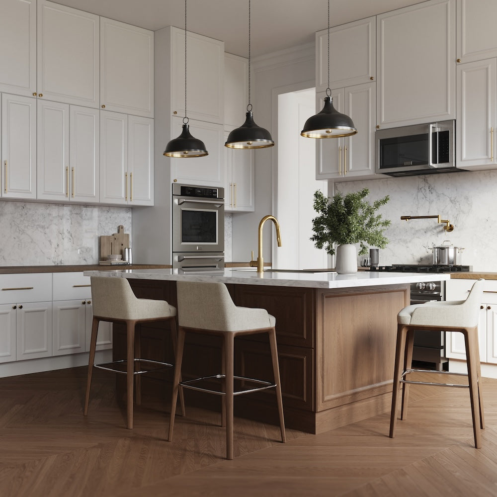 ZLINE Gemini Pot Filler in Champagne Bronze (GEM-FPF-CB) in a kitchen with white cabinets, marble countertops, and wooden island.