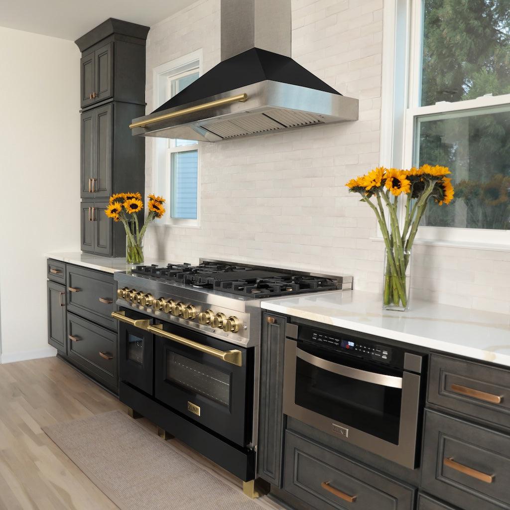 ZLINE Autograph Edition Convertible Fingerprint Resistant DuraSnow® Stainless Steel Range Hood with Black Matte Shell and Polished Gold Handle (KB4SNZ-BLM-G) in a luxury kitchen with matching range and microwave.