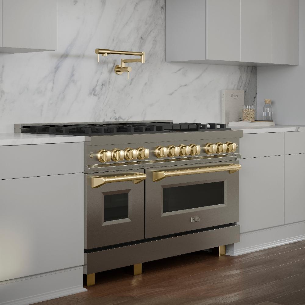 ZLINE Autograph Edition 48 in. 6.0 cu. ft. Dual Fuel Range with Gas Stove and Electric Oven in Stainless Steel with Polished Gold Accents (RAZ-48-G) in a modern white kitchen with marble backsplash and matching gold pot filler.