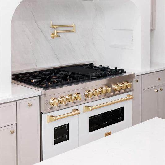 ZLINE Autograph Edition 48 in. 6.0 cu. ft. Dual Fuel Range with Gas Stove and Electric Oven in Stainless Steel with White Matte Doors and Polished Gold Accents (RAZ-WM-48-G) in a white farmhouse kitchen below matching pot filler.