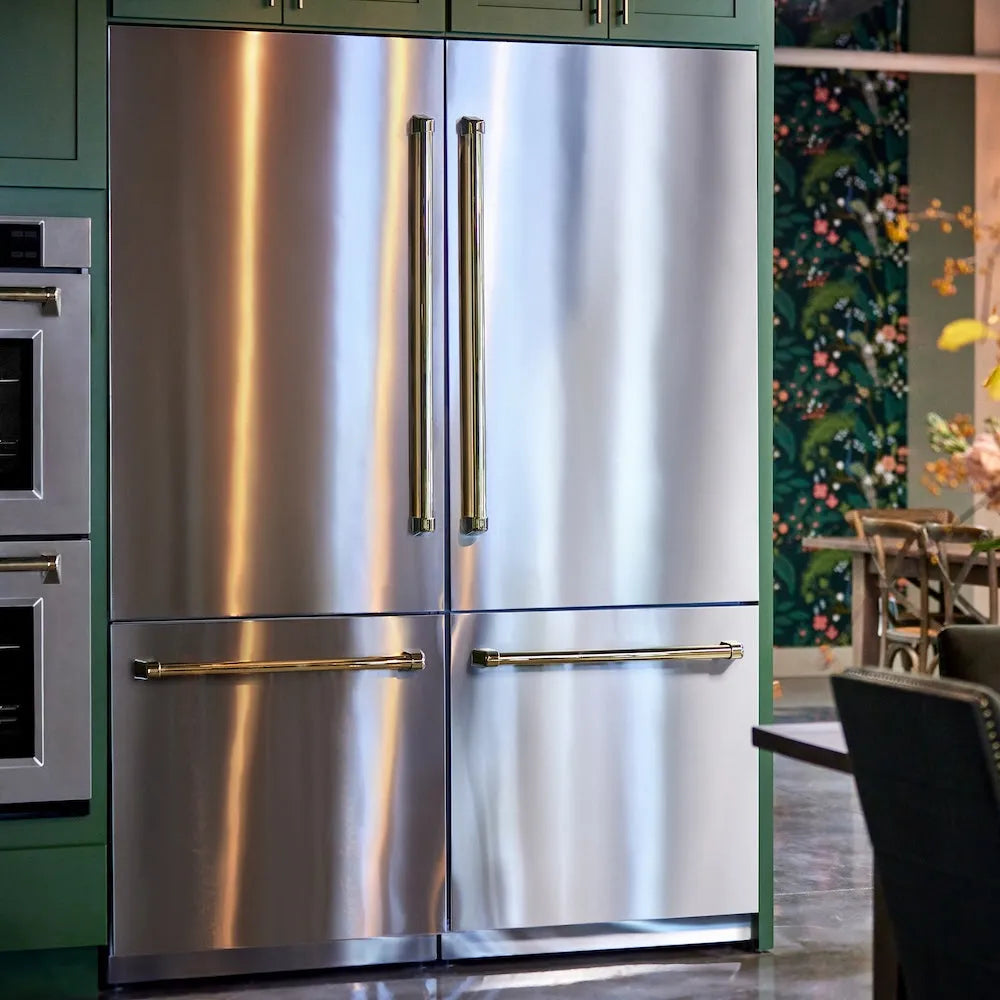 ZLINE Autograph Edition 60 in. 32.2 cu. ft. French Door Built-In Bottom Freezer Refrigerator with Water Dispenser and Ice Maker in Stainless Steel with Polished Gold Accents (RBIVZ-304-60-G) in a kitchen setting with green cabinets and a floral wall.