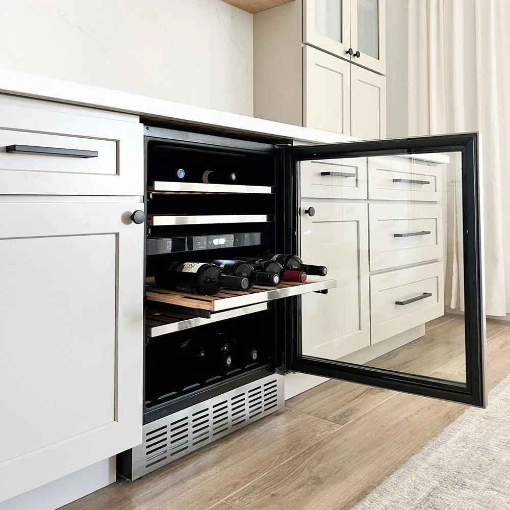 ZLINE 24 in. Monument Dual Zone 44-Bottle Wine Cooler in Stainless Steel (RWV-UD-24) integrated into a kitchen cabinet with wine bottles inside.