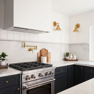 Farmhouse kitchen with ZLINE 30 in. 4.2 cu. ft. Paramount Gas Range with 4 Burner Cooktop and Convection Gas Oven in Stainless Steel (SGR30), black cabinets, and white countertops.