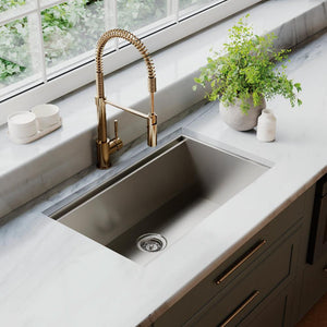 ZLINE Garmisch 30 in. Undermount Single Bowl Stainless Steel Kitchen Sink with Bottom Grid and Accessories (SLS-30) in a luxury kitchen with marble countertops and blue kitchen cabinets.