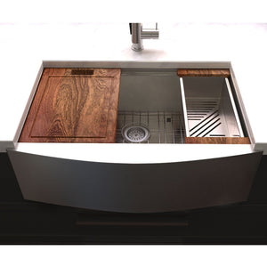 ZLINE Moritz 33 in. Farmhouse Apron Mount Single Bowl Stainless Steel Kitchen Sink with Bottom Grid and Accessories (SLSAP-33) in a farmhouse-style kitchen, front.