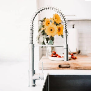 ZLINE Sierra Pull Down Spring Single Handle Kitchen Faucet in Brushed Nickel (SRA-KF-BN) in a cottage-style kitchen.