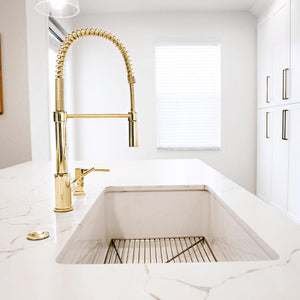 ZLINE Sierra Pull Down Spring Kitchen Faucet in Polished Gold (SRA-KF-PG) in an immaculate white kitchen, side.