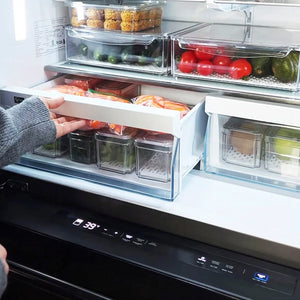 Person reaching into a modern ZLINE 36 in. 21.6 cu. ft. Counter-Depth French Door Refrigerator with Water and Ice Dispenser in Fingerprint-Resistant Black Stainless Steel (RFM-W-36-BS) with multiple compartments filled with food.