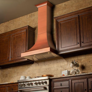 ZLINE Designer Series Copper Finish Wall Range Hood (8632C) in a rustic-style kitchen from below, side.