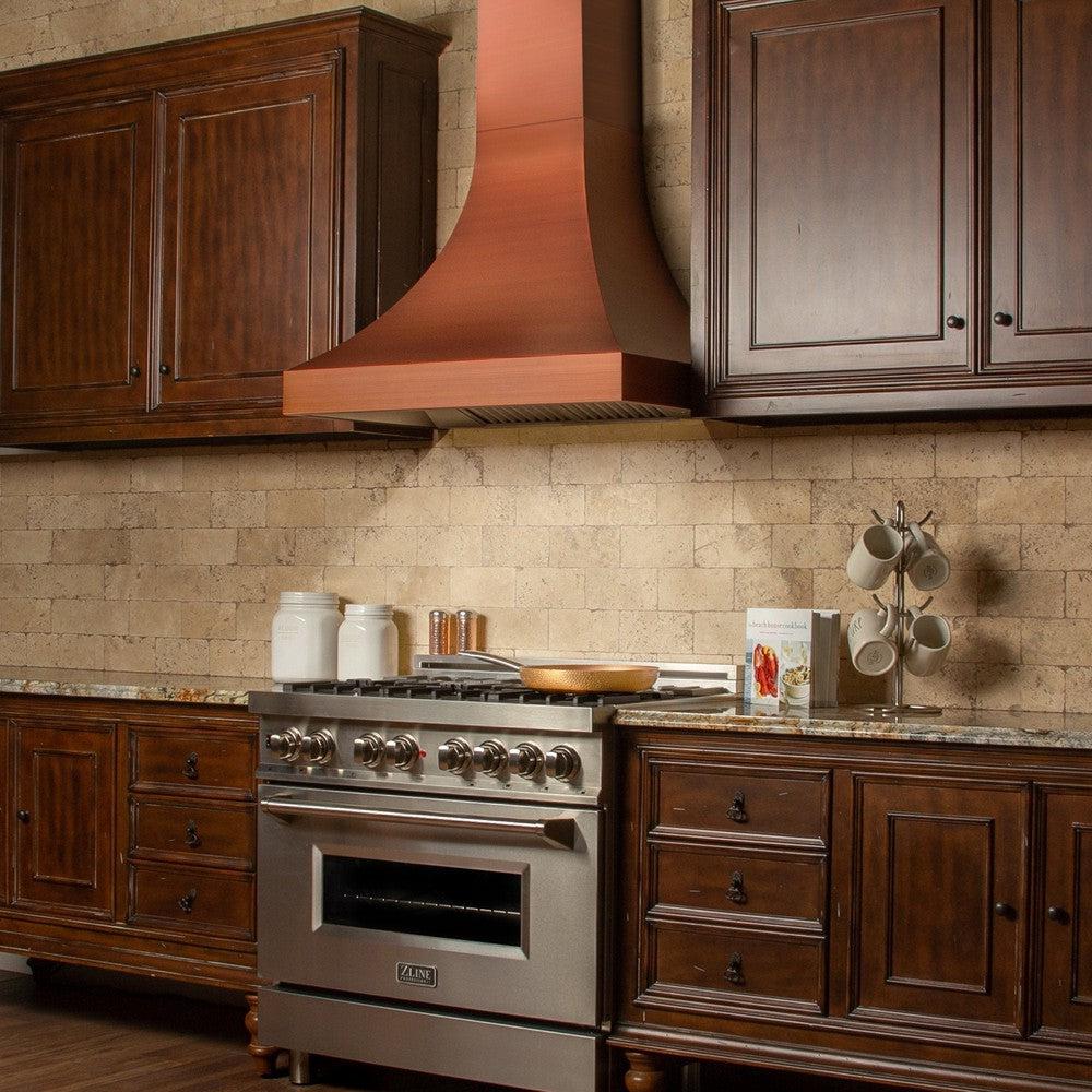 ZLINE Designer Series Copper Finish Wall Range Hood (8632C) in a rustic-style kitchen, from side.